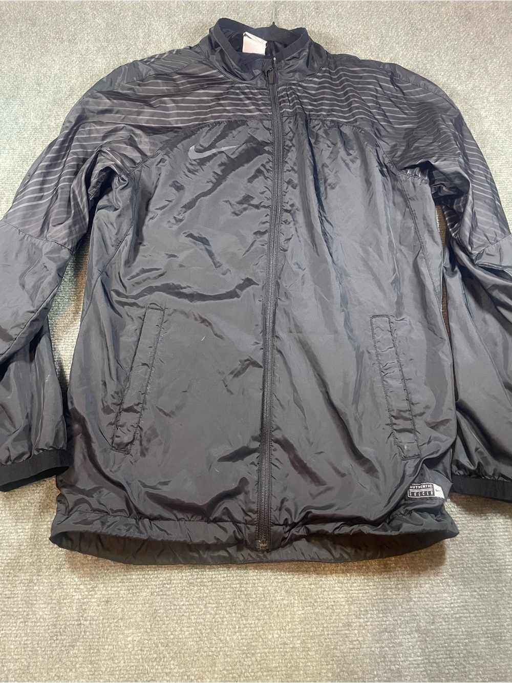 Nike Men's Black Soccer Windbreaker Jacket with Subtle Stripe Detail